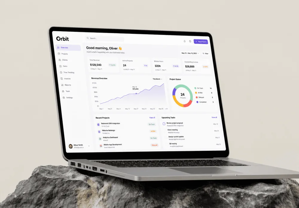 Analytics dashboard on a laptop resting on a rock